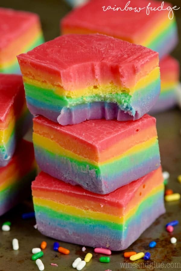 A stack of three Rainbow Fudge cubes show the distinct colors of the rainbow (red, orange, yellow, green, blue, and purple). 