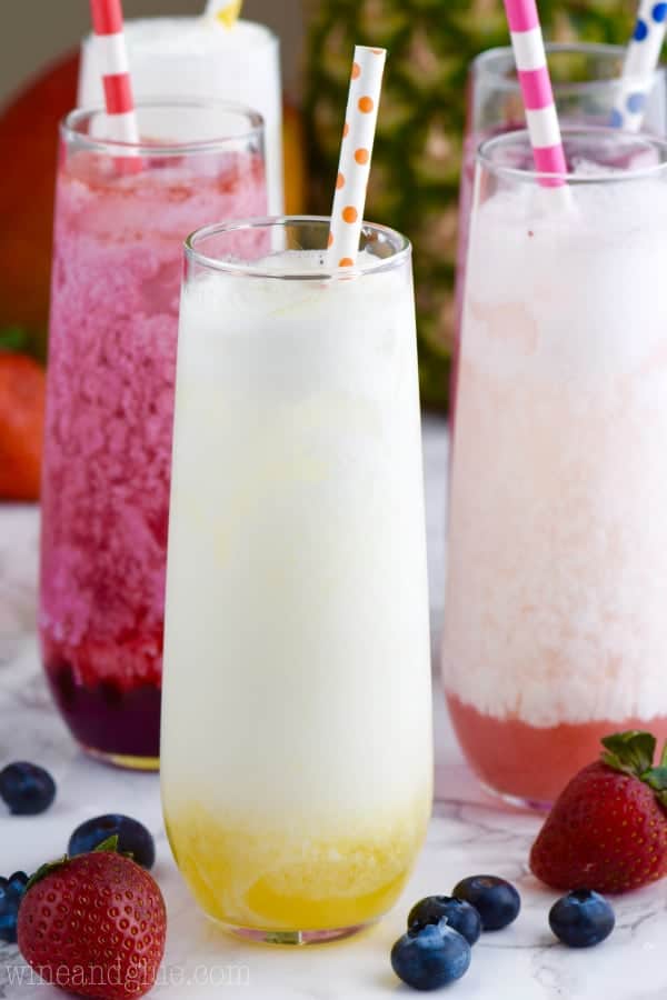 In long glasses, the Skinny Italian sodas have different flavorings of blueberry, strawberry, and lemon with some cream placed into it. 