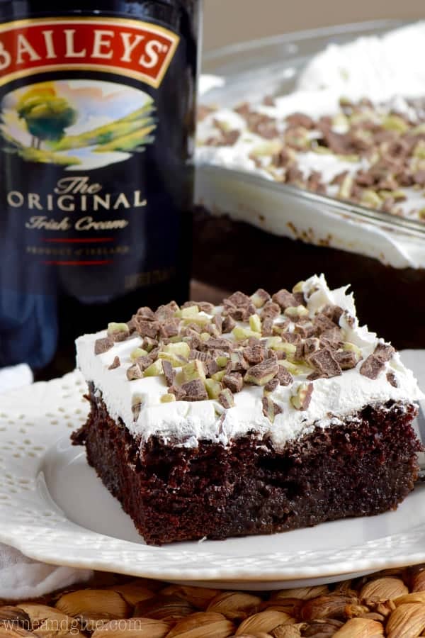 The Baileys Poke Cake has a airy chocolate cake layer topped with cool whip and smashed Andes Baking Chips.