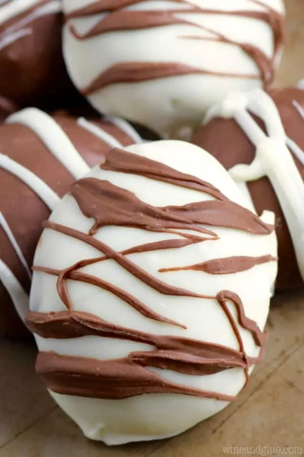 A white chocolate egg is drizzled with some milk chocolate creating a zebra stripe pattern for the Fudge Filled Easter Eggs. 