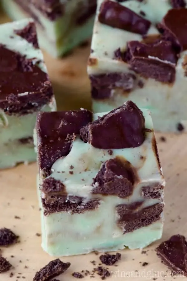 A small cube of the Grasshopper Fudge has a mint green tint with speckles of the grasshopper cookies. 