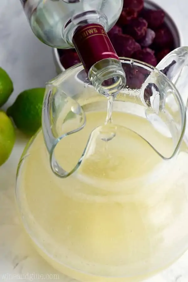 Lastly, the cherry vodka is being poured into the pitcher. 