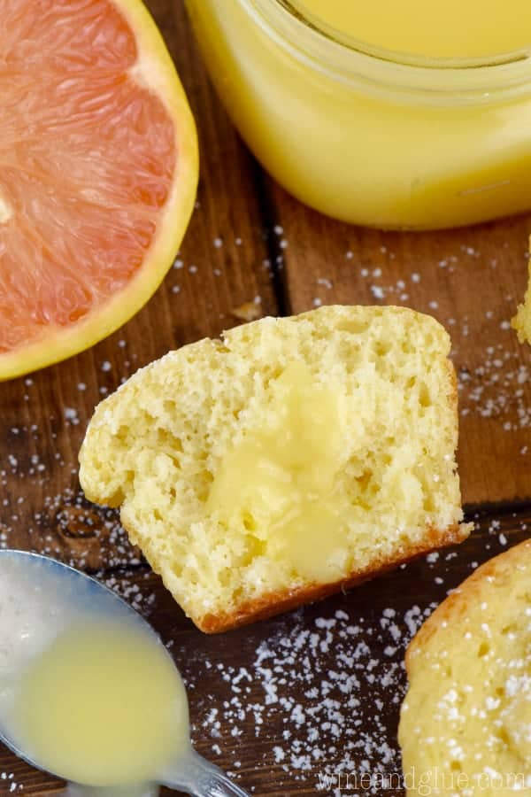 The Grapefruit Spread is drizzled on top of a half eaten Grapefruit Muffin. 