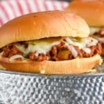 Close up photo of Italian Sloppy Joe sandwich. Potato chips on the side. - 8