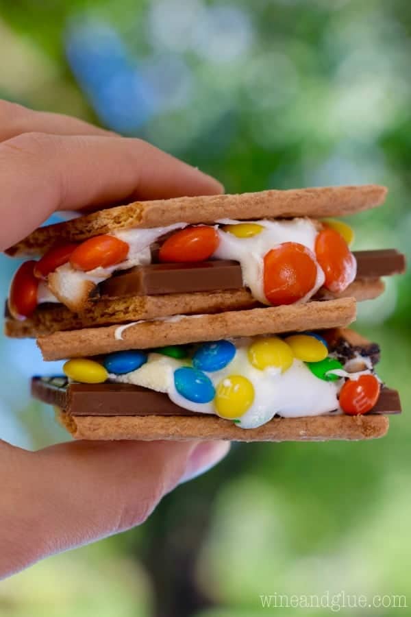 A two stacked Candy Coated S'mores with M&M as in the melted marshmallow. 