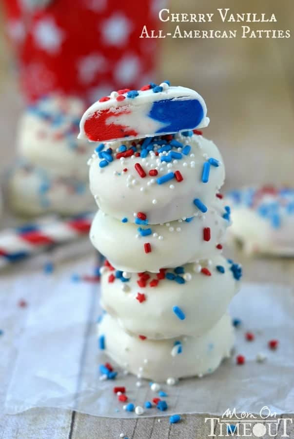The Cherry Vanilla All American Patties have a red, white, and blue marbling dipped into white chocolate and topped with blue, white, and red sprinkles. 