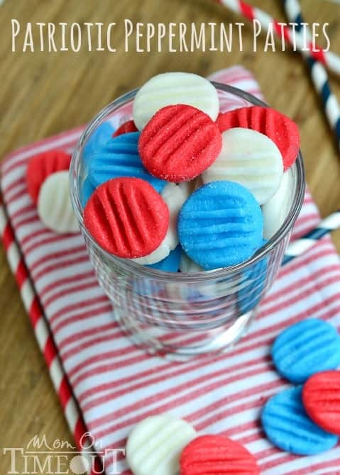 In a glass, the Red White and Blue Patriotic Peppermint Patties are in a circular shape with four lined indents. 