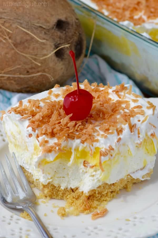 The No Bake Pina Colada Lush has a golden Oreo crust with a fluffy cream and chunks of pineapples for a middle and topped with roasted coconuts. 