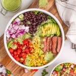 overhead photo of a southwestern steak salad separated by ingredients in a bowl
