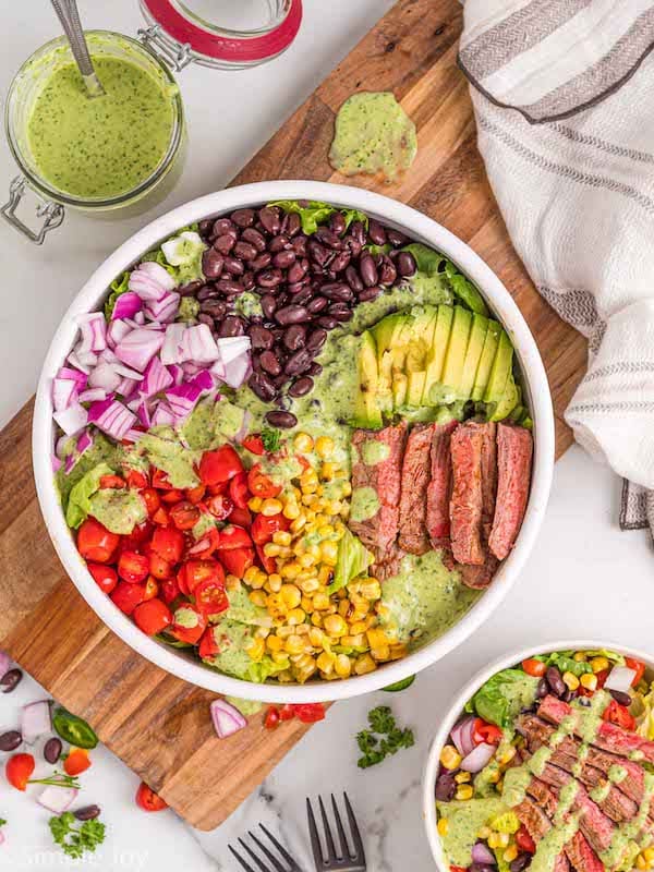 overhead photo of a southwestern steak salad separated by ingredients in a bowl