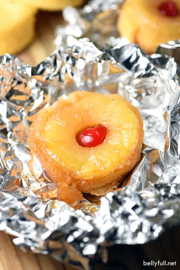 In a little tin foil, the Pineapple Upside-Down Cake Foil Packets has a small slice of pineapple on top with a cherry in the middle.