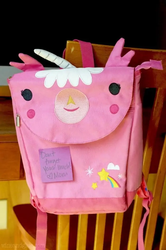 A picture of a unicorn backpack with a note from mom. 