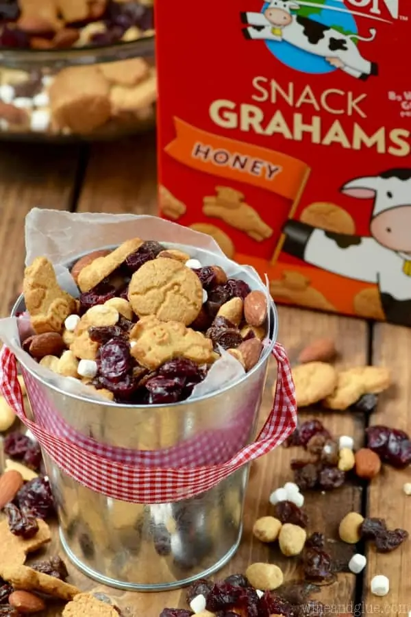 In a little bucket, the S'mores Trail Mix in front the Horizon's Snack Grahams. 