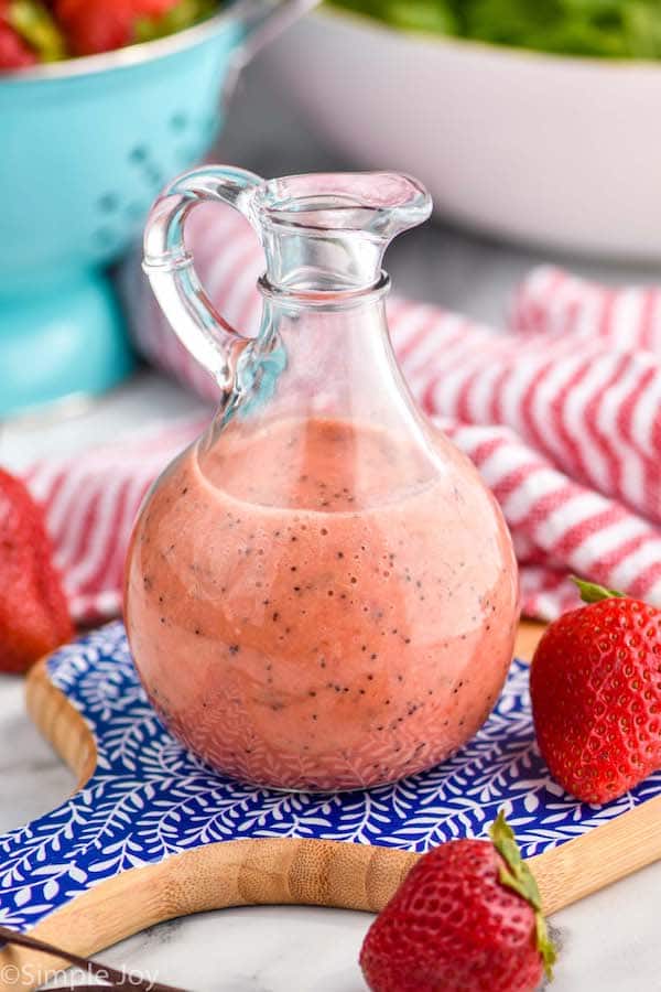 close up of a salad dressing bottle holding strawberry salad dressing
