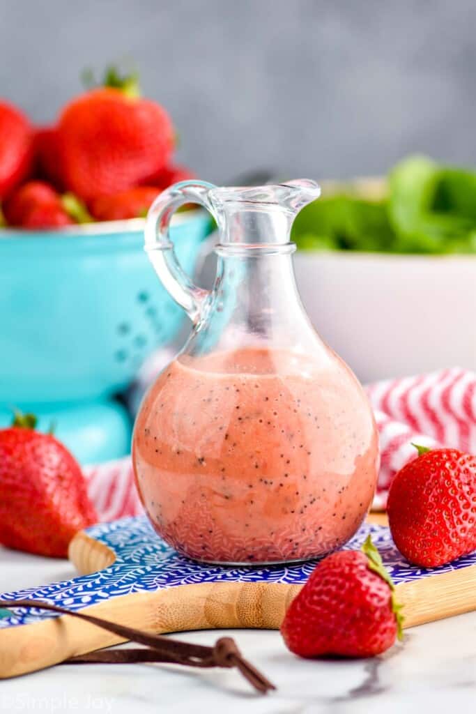 a small bottle of strawberry spinach salad dressing