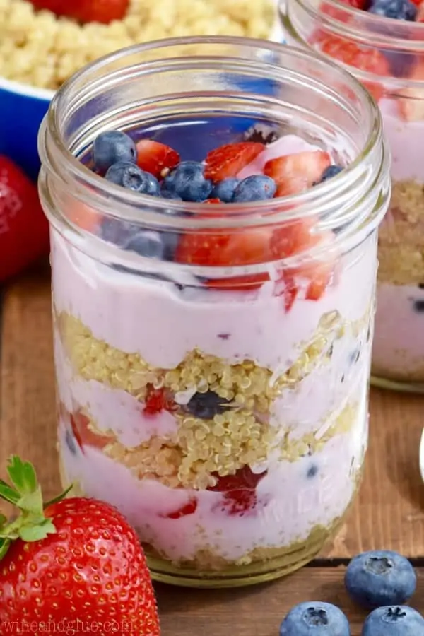 In glass mason jars, the Quinoa Berry Parfait had distinct layers of mixed berry yogurt, quinoa, sliced strawberries, and blueberries. 