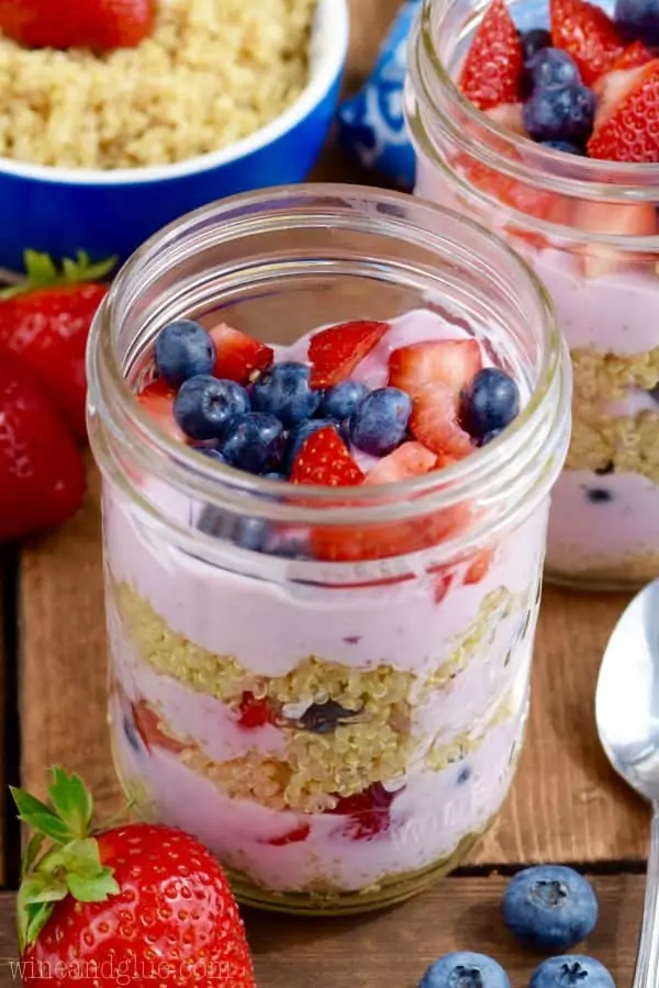 In glass mason jars, the Quinoa Berry Parfait had distinct layers of mixed berry yogurt, quinoa, sliced strawberries, and blueberries. 