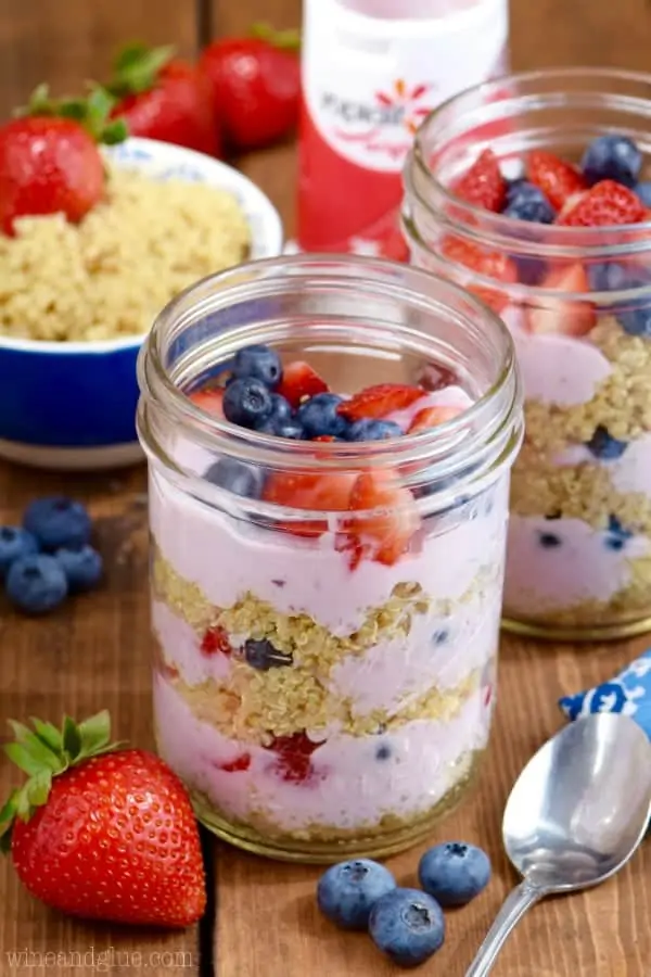 In glass mason jars, the Quinoa Berry Parfait had distinct layers of mixed berry yogurt, quinoa, sliced strawberries, and blueberries. 