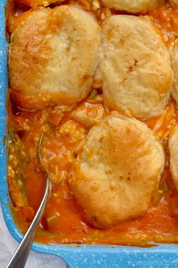 In a casserole dish, the Buffalo Chicken Pot Pie has golden brown biscuits covering the filling. 