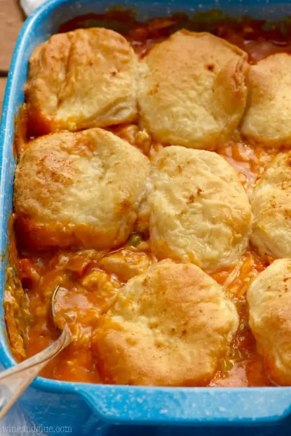 In a casserole dish, the Buffalo Chicken Pot Pie has golden brown biscuits covering the filling. 