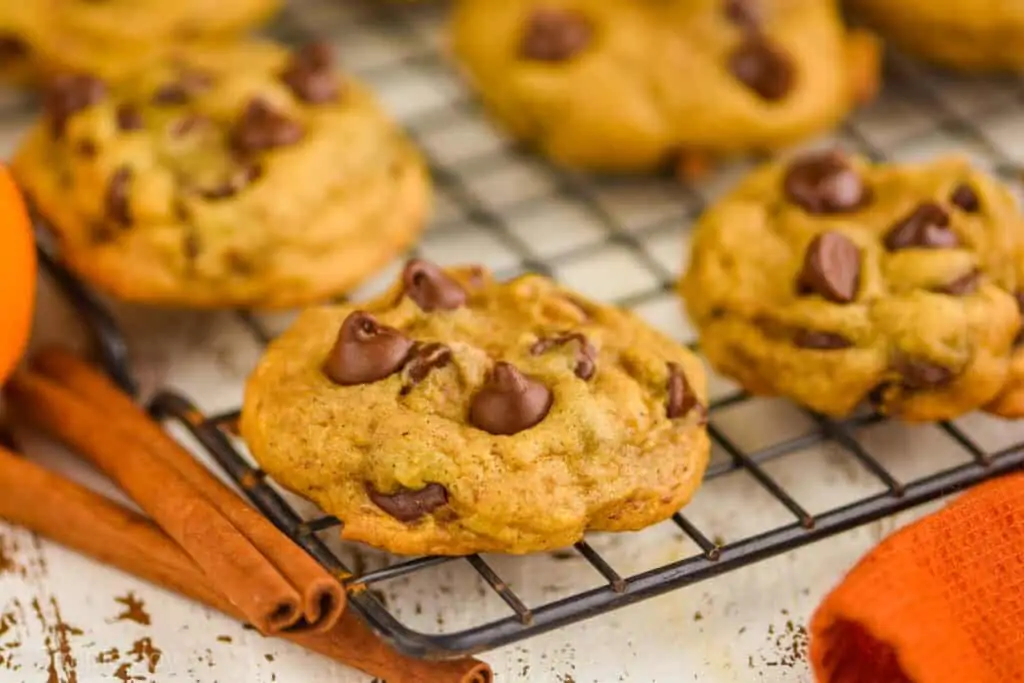 several pumpkin chocolate chip cookies on a wire cooling rack