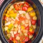 overhead of crockpot sweet and sour chicken in a slow cooker