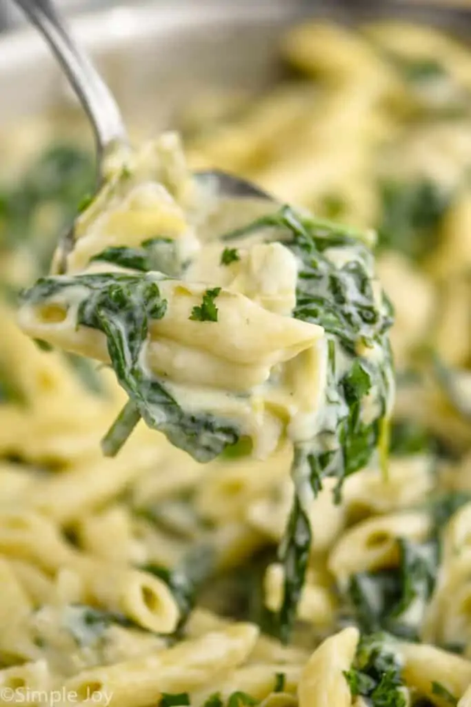 spoonful of spinach artichoke pasta