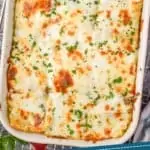 pinterest graphic showing overhead of a baking dish full of chicken lasagna