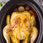 overhead view of a crockpot whole chicken in a slow cooker