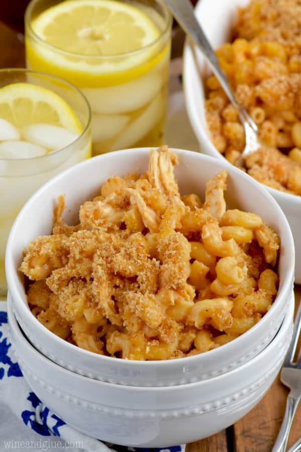 In a white bowl, the BBQ Chicken Macaroni and Cheese has breadcrumbs and chicken mixed in. 