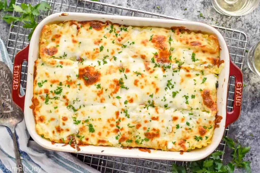 overhead photo of a baking dish will chicken lasagna in it