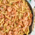 one pot creamy shrimp pasta in a skillet, garnished with parmesan and parsley - 5