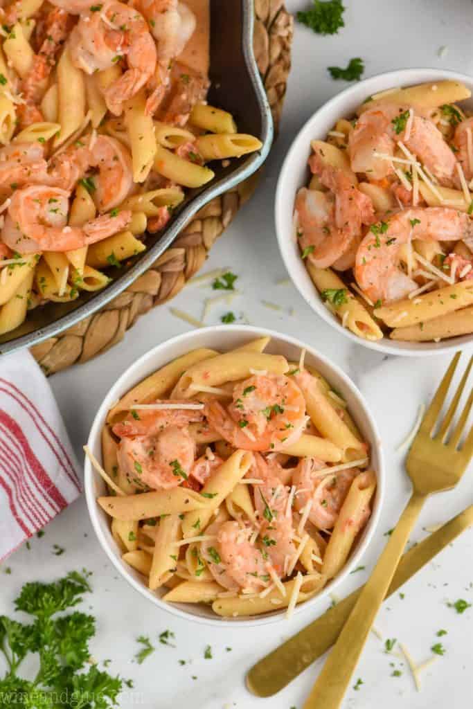 overhead view of one pot cream shrimp pasta recipe in bowls
