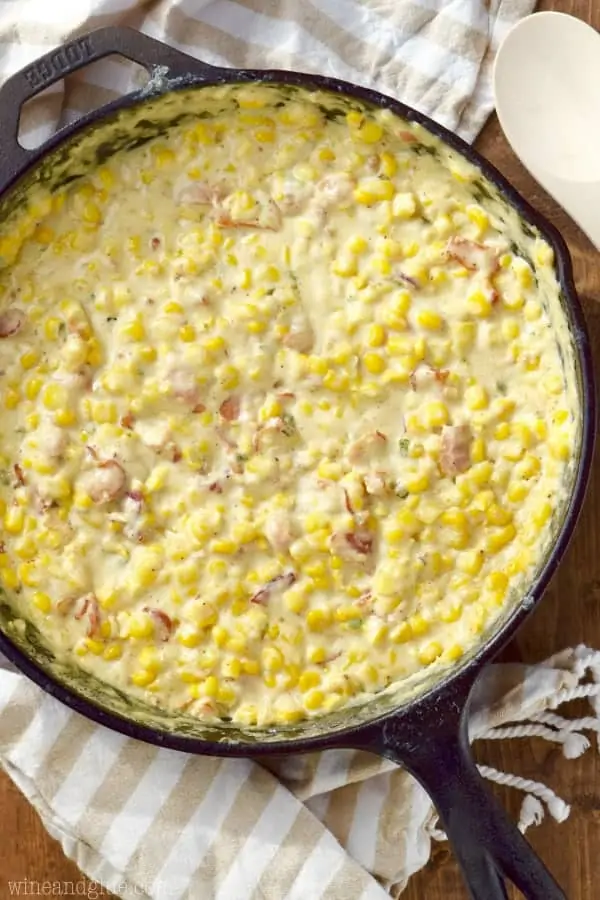 An overhead photo of Bacon Jalapeno Cream Corn which is creamy and colorful for the corn, bacon, and jalapeno. 