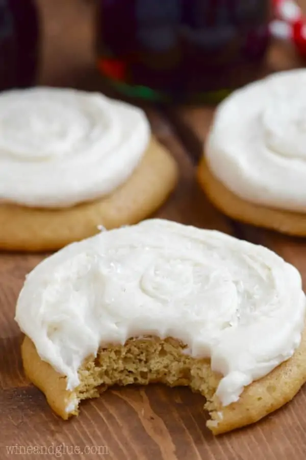 A Coca-Cola Cookie with a little bit into it showing the fluffy center. 