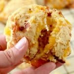 Image of hand holding easy bacon cheddar biscuit