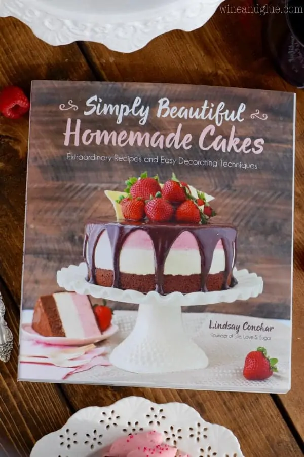 An overhead photo of a magazine that says Simply Beautiful Homemade Cakes by Lindsay Conchar. 