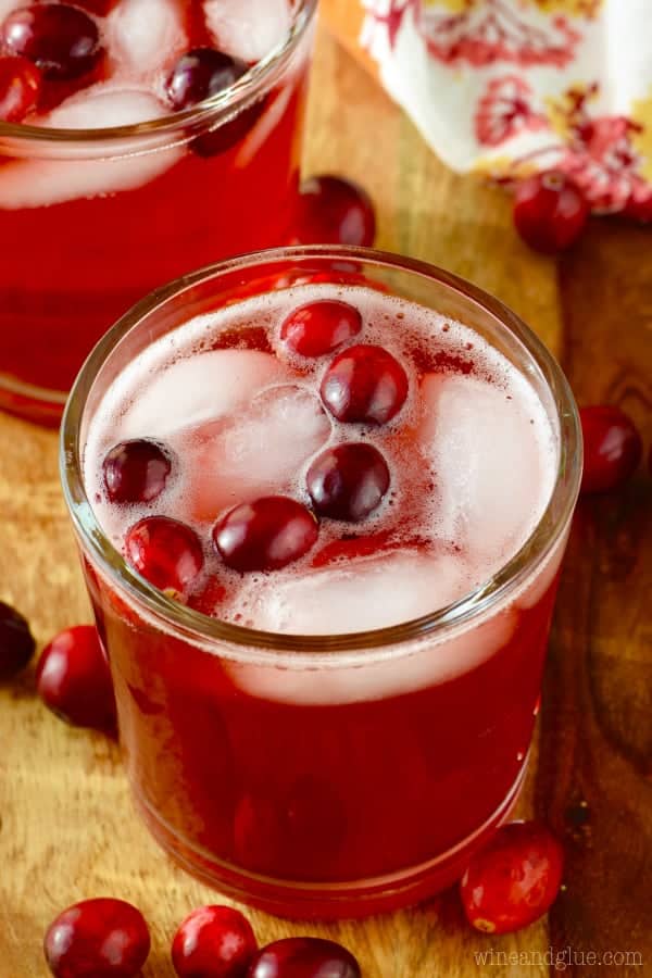 The Cranberry Vodka Press fills a glass with whole cranberries and ice. 