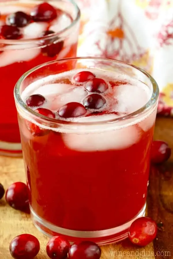The Cranberry Vodka Press fills a glass with whole cranberries and ice. 