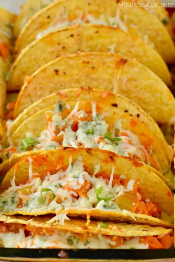 The Buffalo Baked Tacos are in hard taco shells and inside are buffalo chicken and melted cheese. 