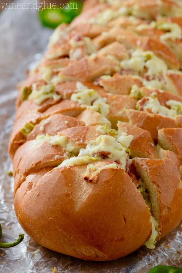 The Jalapeno Popper Pull Apart Bread has melted cheese oozing out with minced jalapeños on top. 