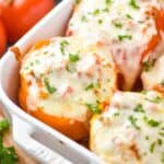 close up of a orange Italian stuffed pepper in a casserole dish - 14