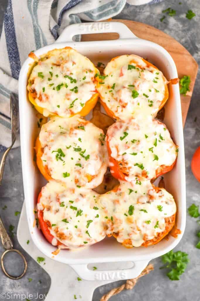 overhead of stuffed pepper recipe in a white casserole dish and garnished with fresh parsley