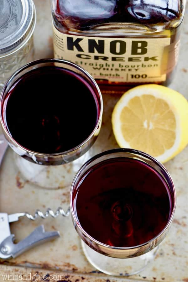 An overhead photo of the Whiskey and Wine Cocktail that are in long necked glasses. 