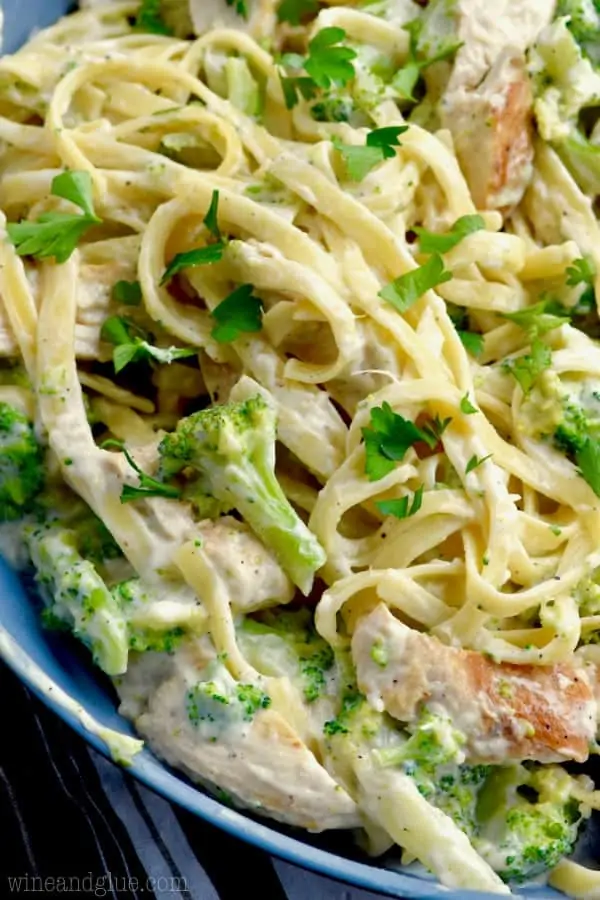 A closeup on the Lighter Fettuccine Alfredo showing that the Alfredo sauce lightly covering the broccoli, pasta, and chicken. 