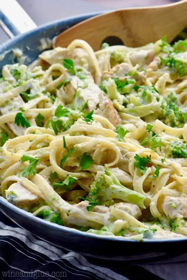 The Lighter Fettuccine Alfredo is in a large saucepan topped with parsley. 