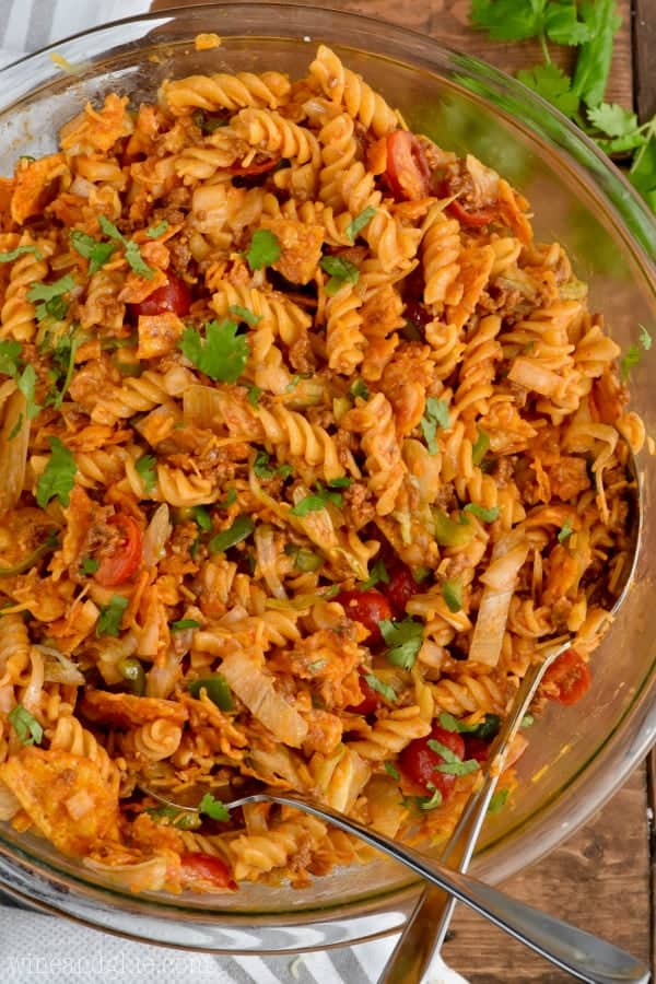 In a clear bowl, the Taco Pasta Salad is topped with cilantro