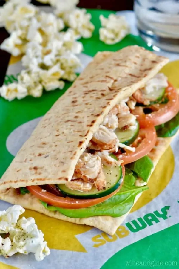 Subway's Rotisserie-Style Chicken sandwich surrounded by the Italian Popcorn. 