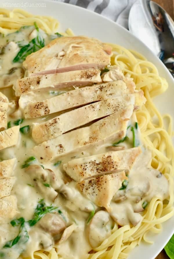 Long strips of chicken and creamy white sauce top the Easy Chicken Fettuccine Alfredo 