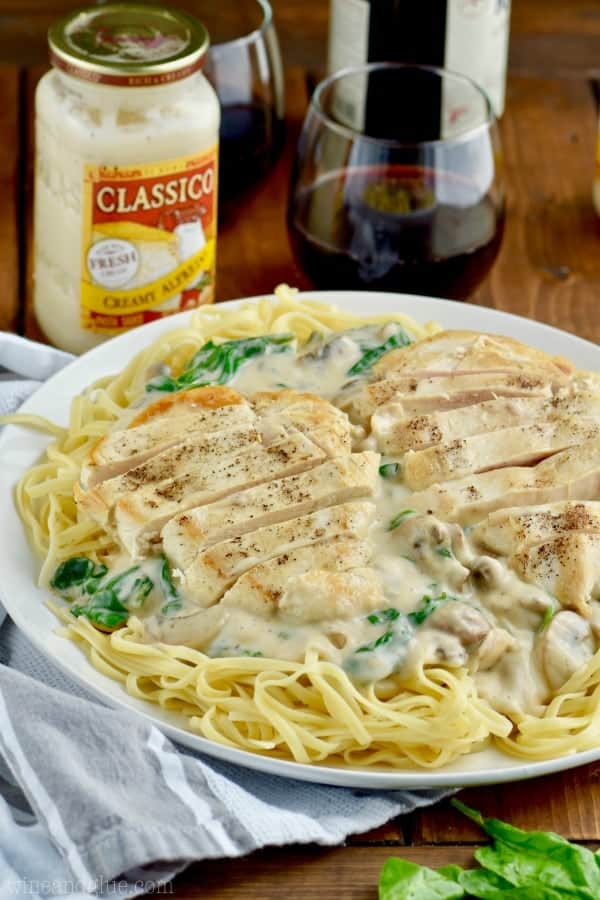 Long strips of chicken and creamy white sauce top the Easy Chicken Fettuccine Alfredo 